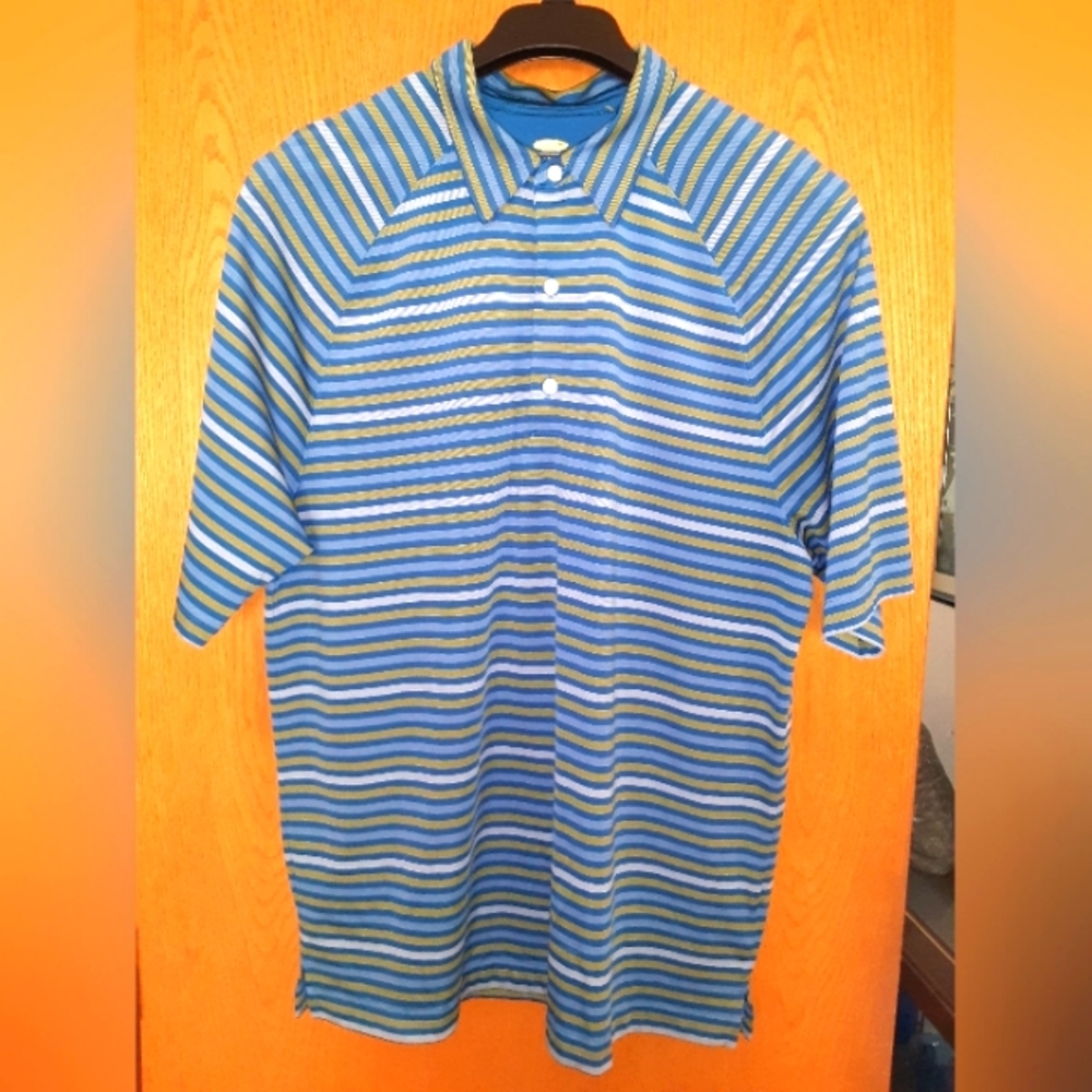 Mens size large,  Greg Norman blue polo shirt